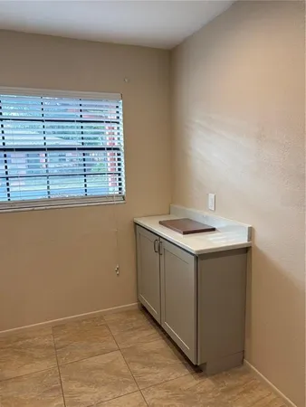 a utility room with a sink washer and dryer