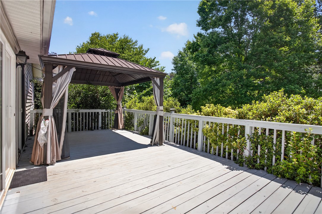 103 Dorsey Lane Walhalla, SC 29691 - Photo 25 of 42 Step out onto this spacious deck, complete with a charming gazebo, perfect for outdoor enjoyment.