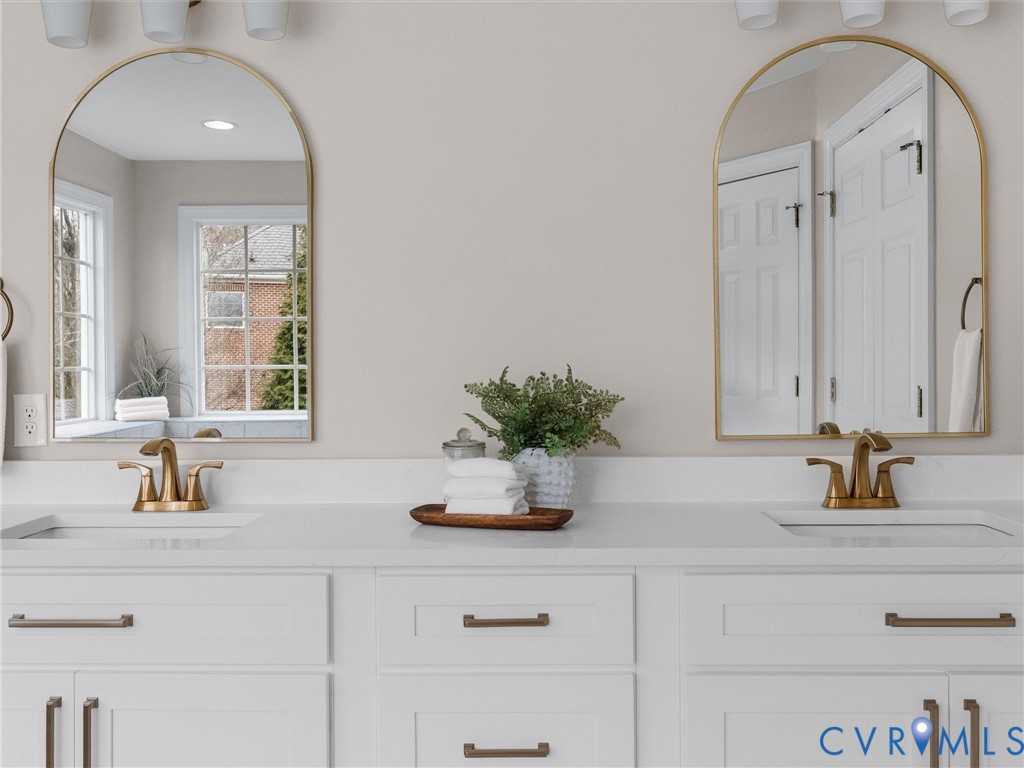 14335 Lander Road Midlothian, VA 23113 - Photo 43 of 70 a bathroom with a sink a potted plant and a window