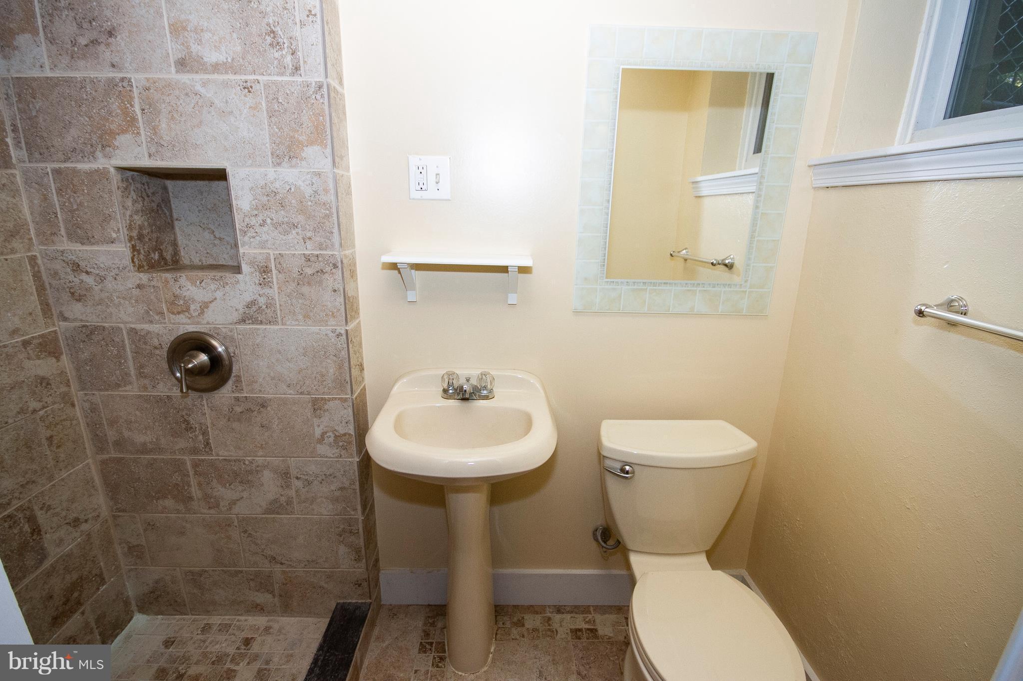 404 Greenlow Road Baltimore, MD 21228 - Photo 14 of 16 Basement Bath with Tiled Shower