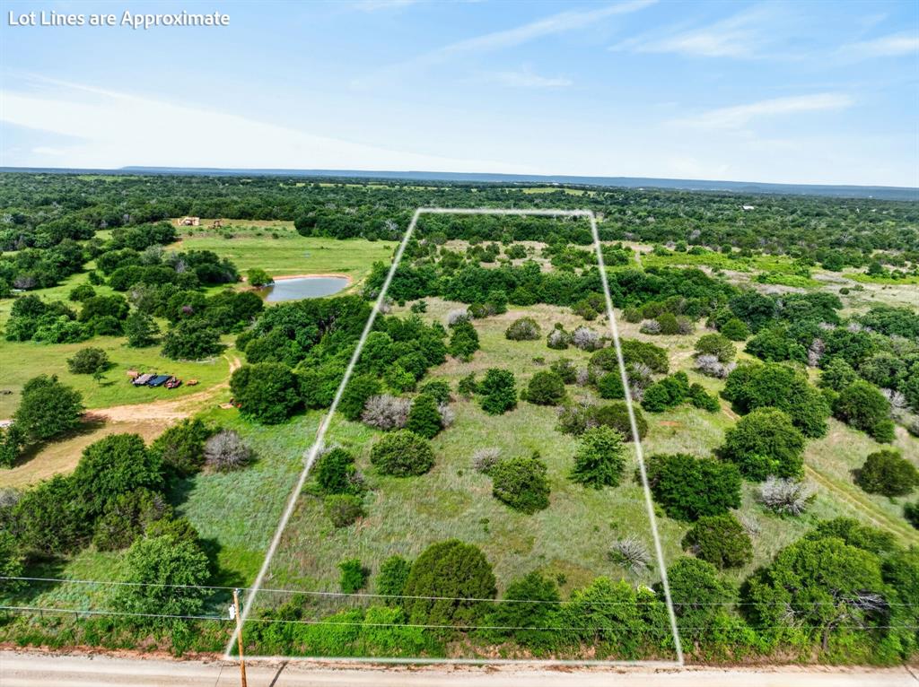 Lot 28 Fairview Road Mineral Wells, TX 76067 - Photo 1 of 16 an aerial view of residential houses with outdoor space and trees