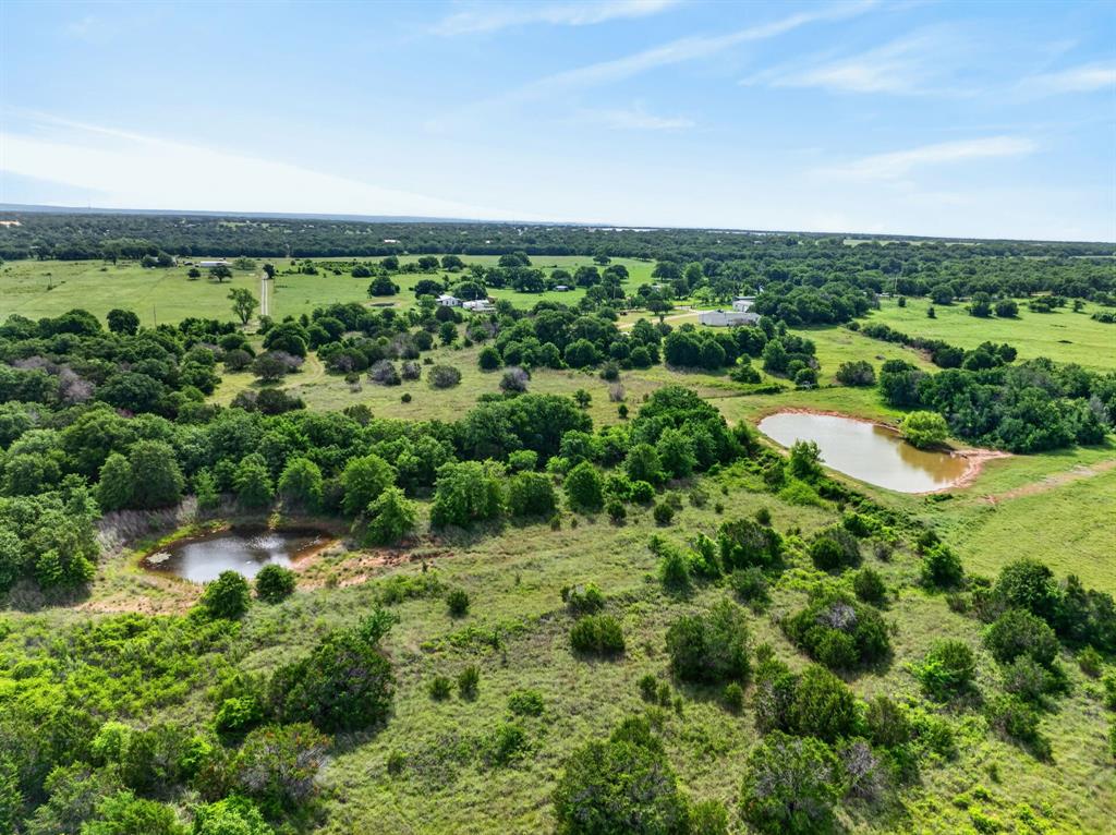 Lot 28 Fairview Road Mineral Wells, TX 76067 - Photo 10 of 16 an aerial view of residential houses with outdoor space and trees