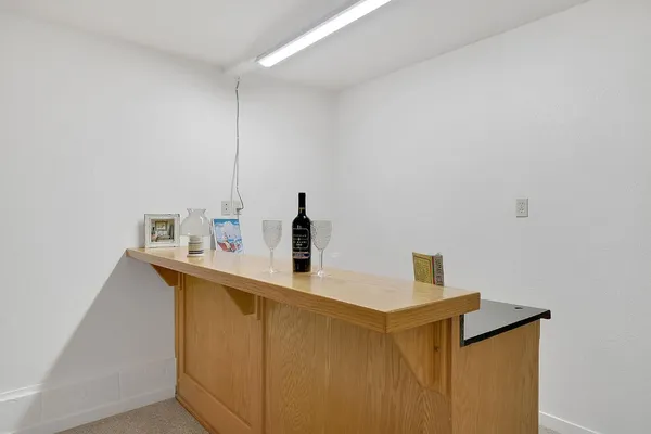 a view of a yard with wooden fence