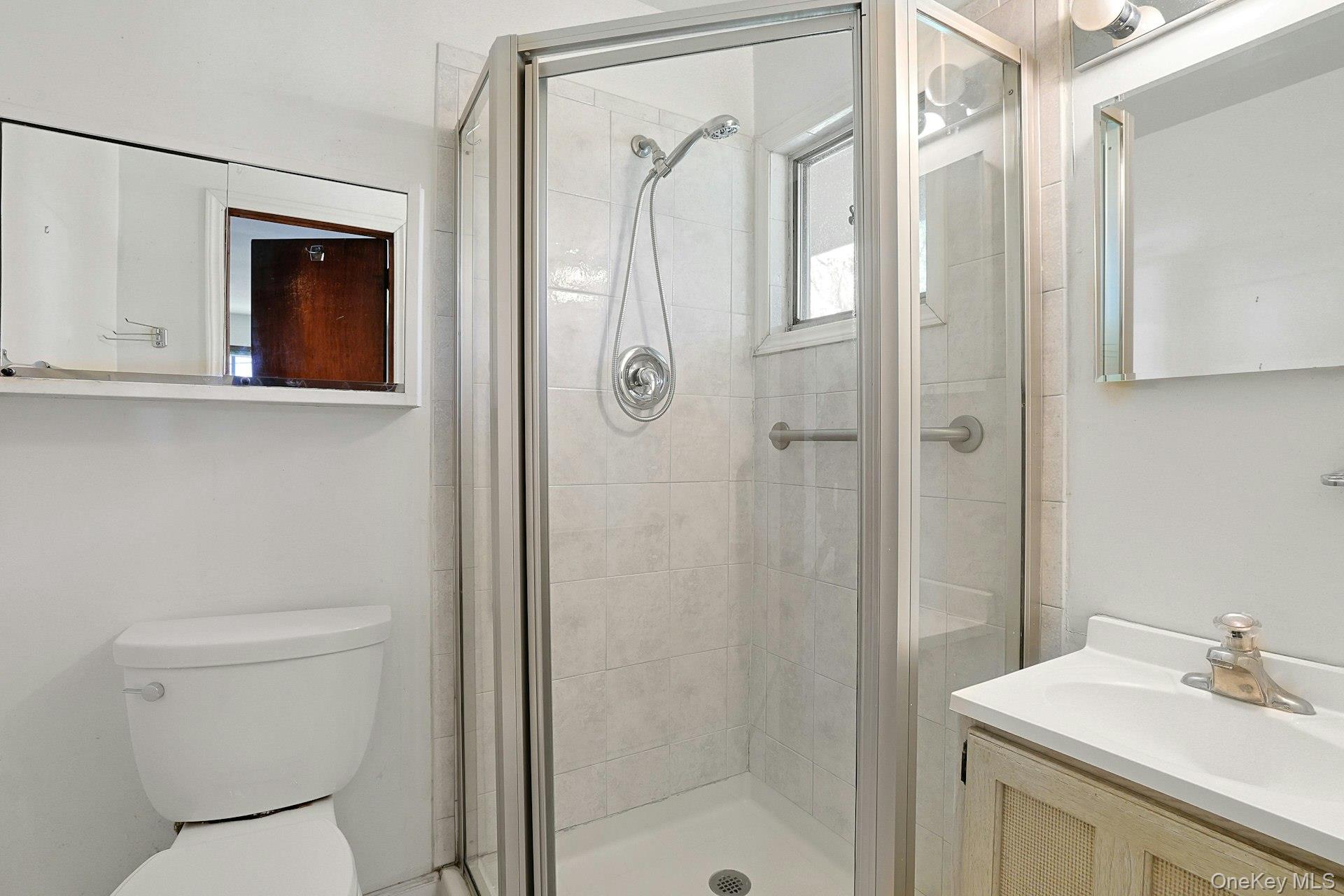 44 Southgate Drive Spring Valley, NY 10977 - Photo 17 of 24 a bathroom with a sink toilet and shower