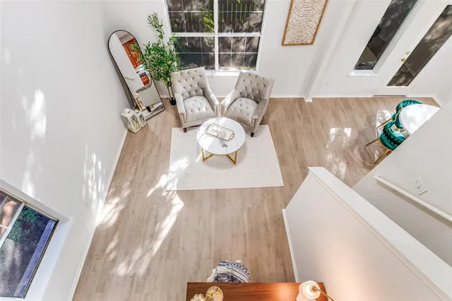 a view of dining room with furniture and wooden floor