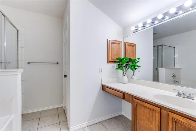 a bathroom with a sink a vanity and a mirror