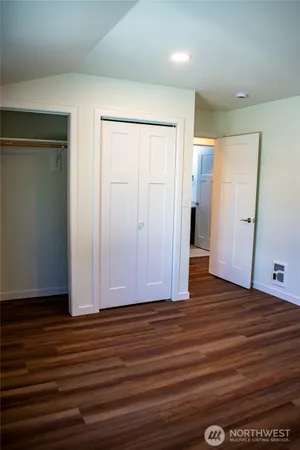 a view of a livingroom with wooden floor