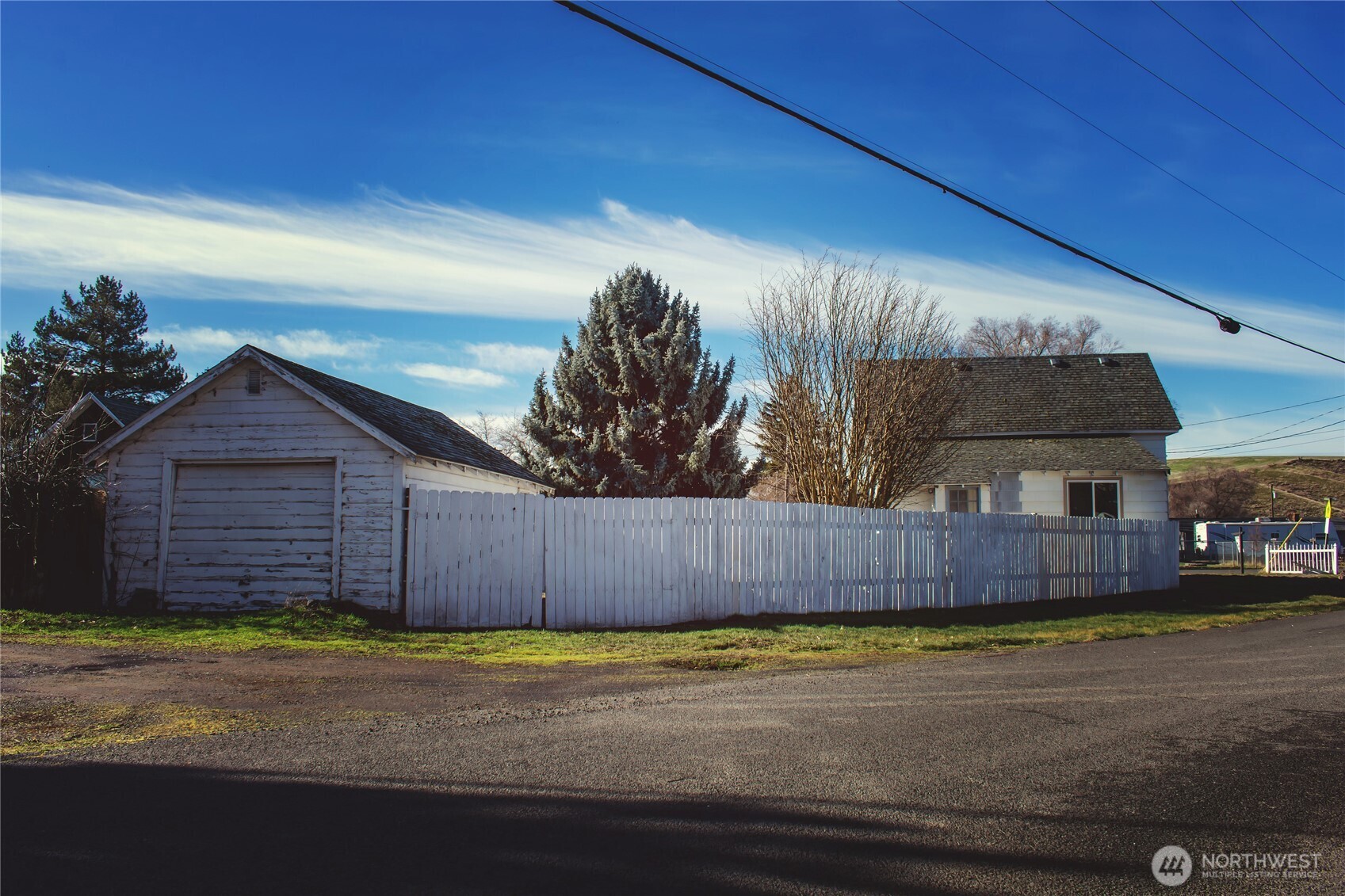 100 D Street Endicott, WA 99125 - Photo 16 of 18 a view of a house with a backyard