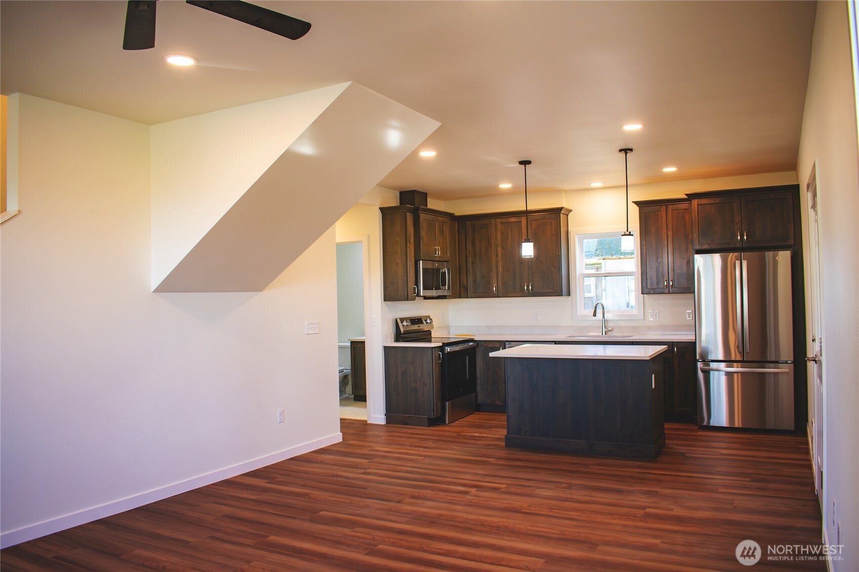 100 D Street Endicott, WA 99125 - Photo 2 of 18 a large kitchen with stainless steel appliances granite countertop a large stove top oven and refrigerator