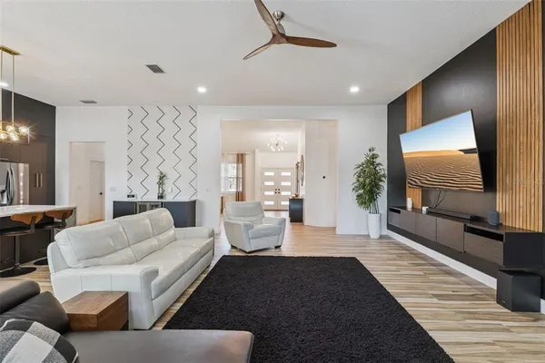a living room with furniture and a flat screen tv