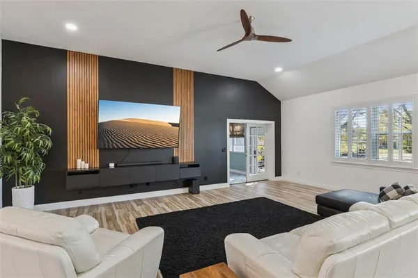 a living room with furniture and a large window