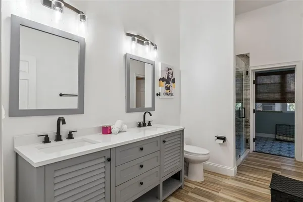 a bedroom with a bed gym equipment and a window