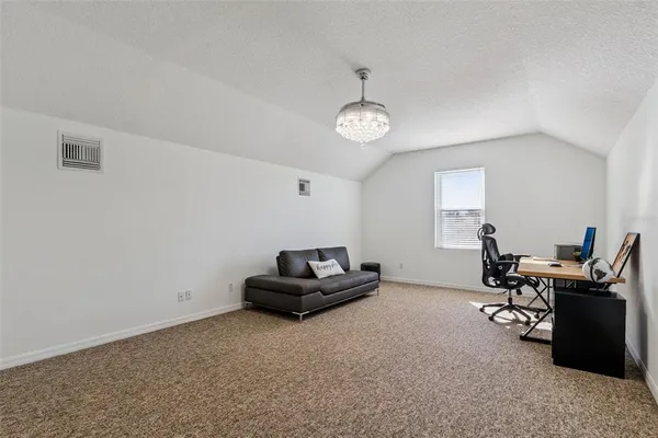 a view of a backyard with sitting area