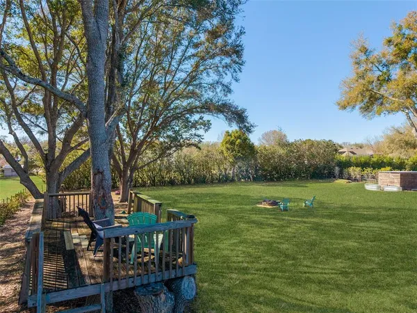 a view of a chair and tables in the deck
