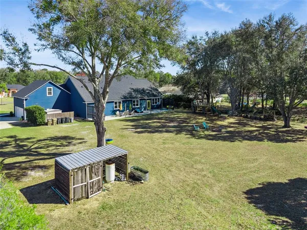 an aerial view of a house with a garden