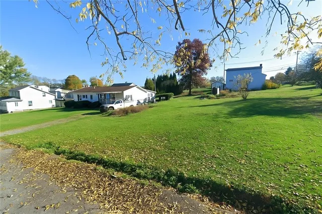 a view of a house with a yard