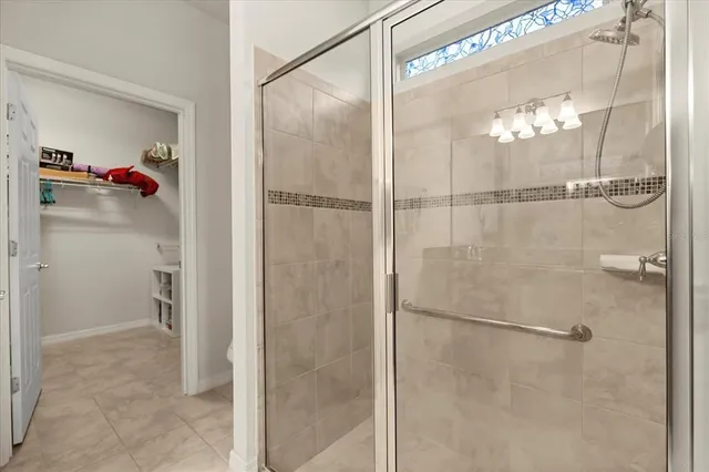 a bathroom with a shower and a sink