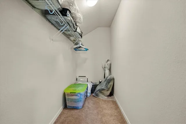 a view of a room with a hanging chair