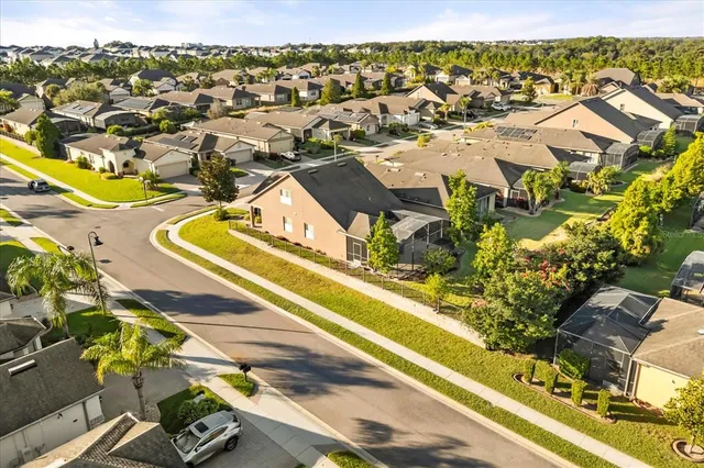 an aerial view of residential houses with outdoor space