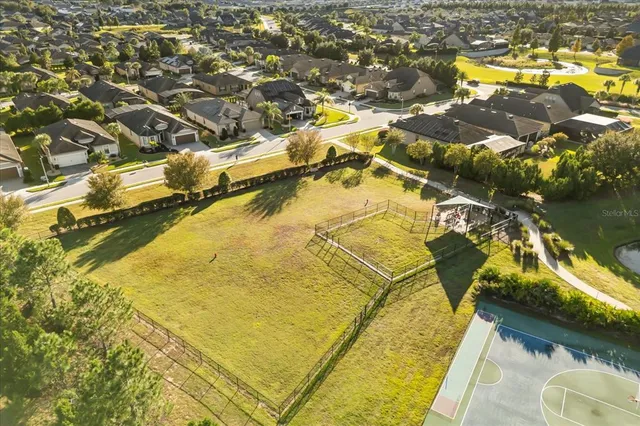 an aerial view of residential houses with swimming pool