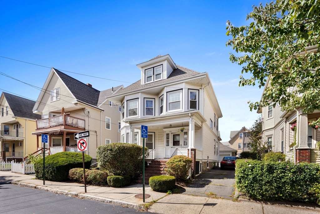 a front view of a building with street view