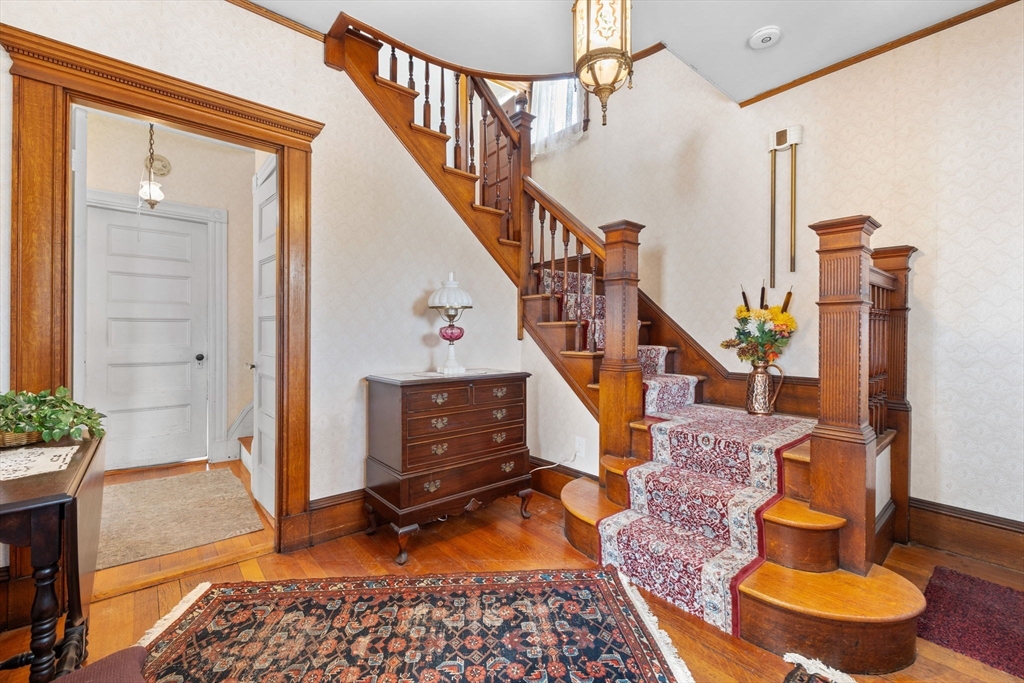 44 Walnut Street Everett, MA 02149 - Photo 12 of 38 a living room with furniture and a fireplace