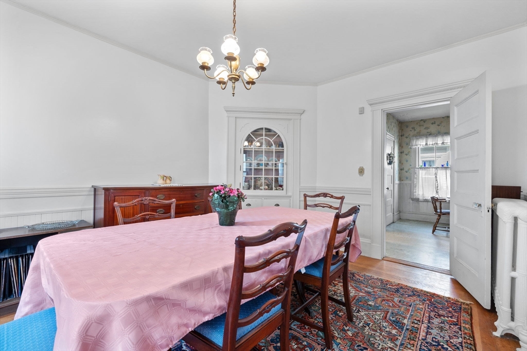 44 Walnut Street Everett, MA 02149 - Photo 14 of 38 a view of a dining room with furniture and chandelier
