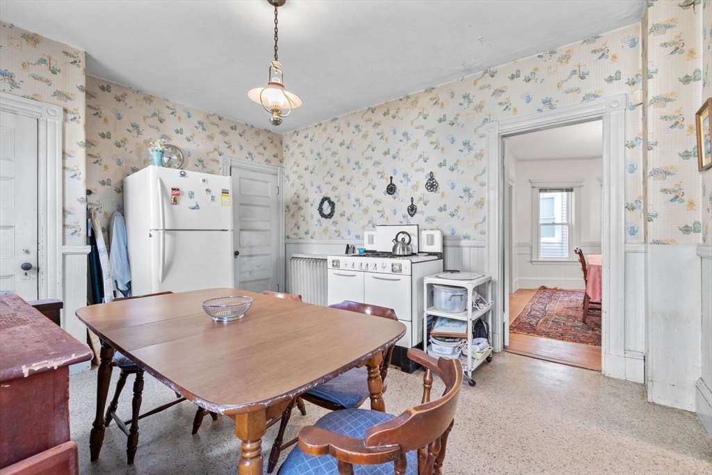 44 Walnut Street Everett, MA 02149 - Photo 17 of 38 a view of a dining room with furniture and wooden floor