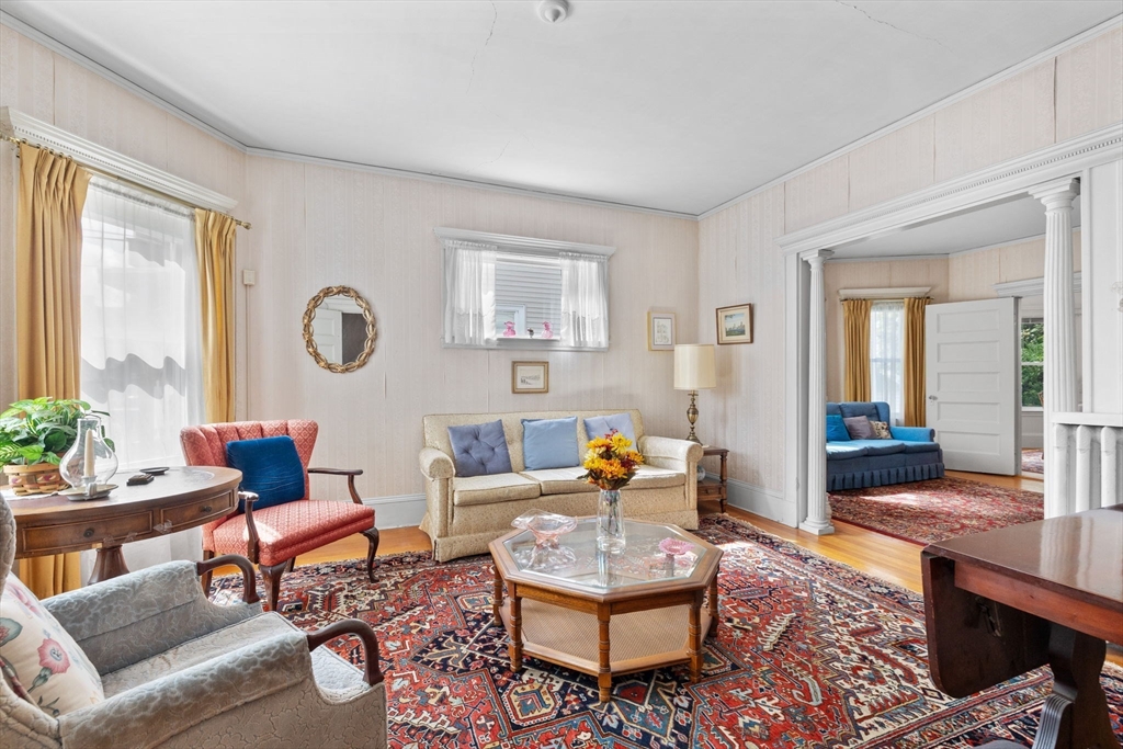 44 Walnut Street Everett, MA 02149 - Photo 2 of 38 a living room with furniture and wooden floor