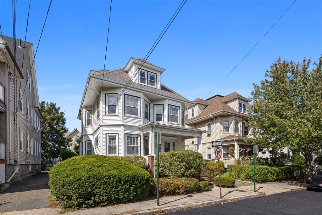 44 Walnut Street Everett, MA 02149 - Photo 33 of 38 a front view of a house with a garden