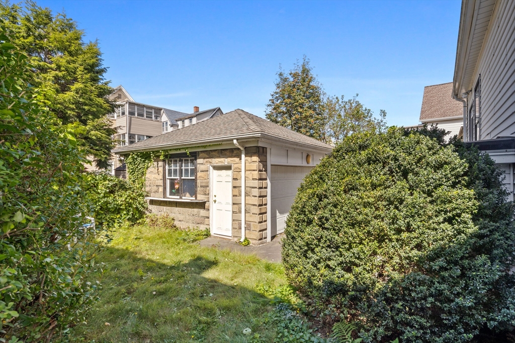 44 Walnut Street Everett, MA 02149 - Photo 34 of 38 a front view of a house with a garden