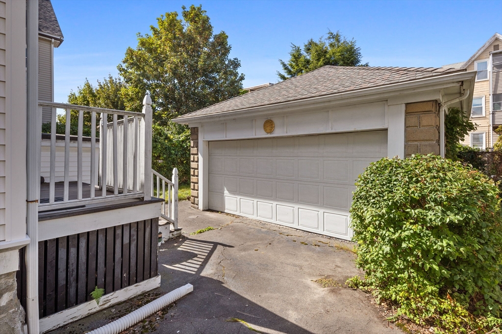 44 Walnut Street Everett, MA 02149 - Photo 35 of 38 a front view of a house with a garage