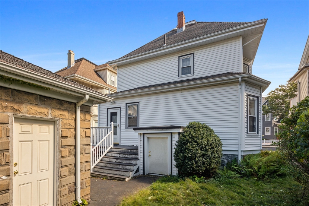 44 Walnut Street Everett, MA 02149 - Photo 36 of 38 a view of a house with wooden fence and large windows