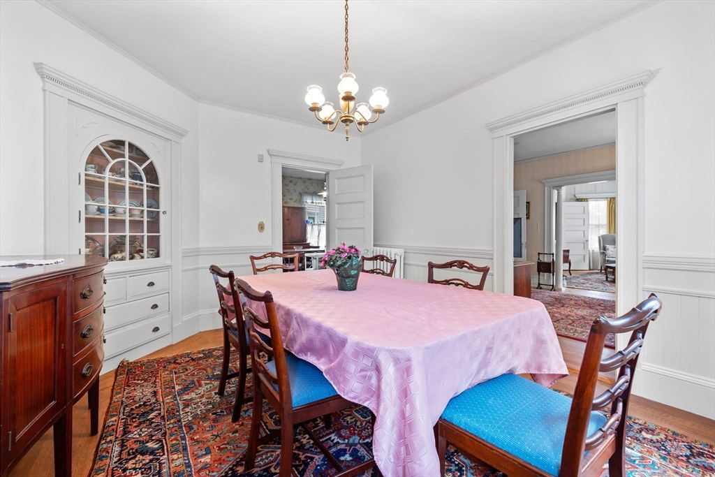 44 Walnut Street Everett, MA 02149 - Photo 4 of 38 a view of a dining room with furniture and chandelier