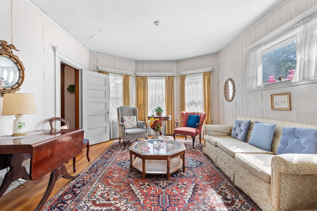 44 Walnut Street Everett, MA 02149 - Photo 8 of 38 a living room with furniture and a large window