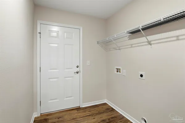 a view of a storage & utility room with wooden floor