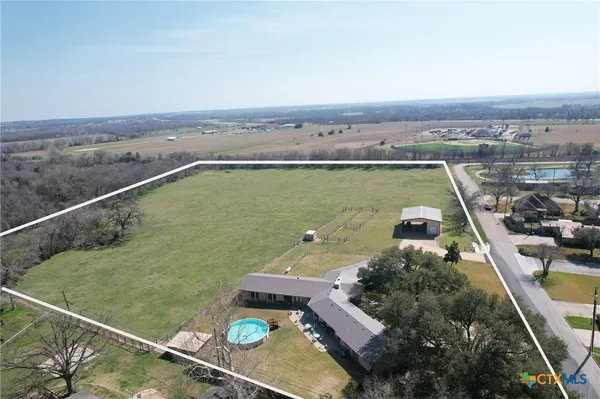 a view of a swimming pool with a terrace