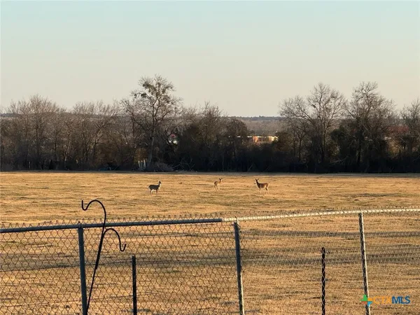a view of swimming pool with an outdoor seating