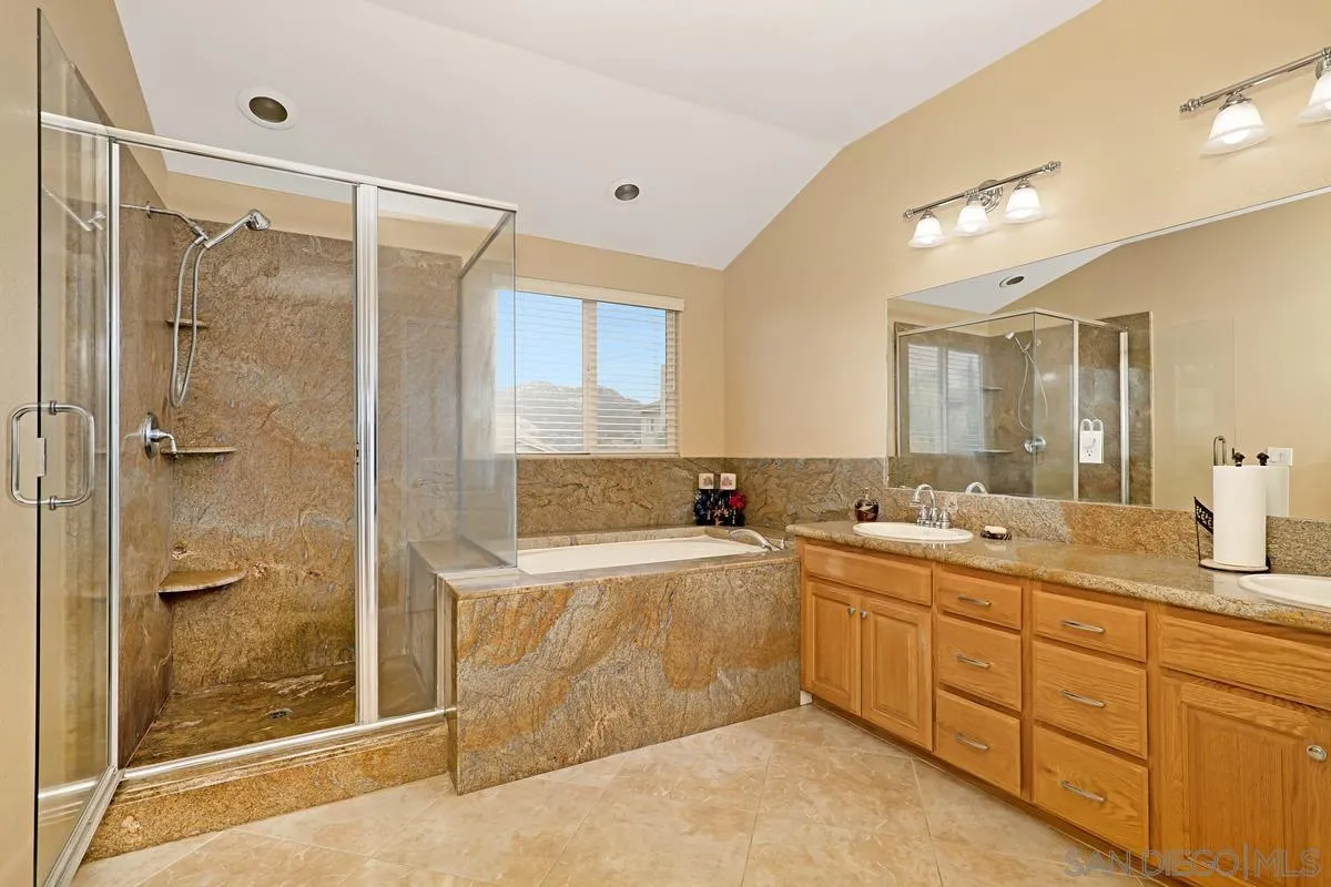 1707 Horizon Heights Circle El Cajon, CA 92019 - Photo 12 of 26 a bathroom with a tub sink mirror and shower