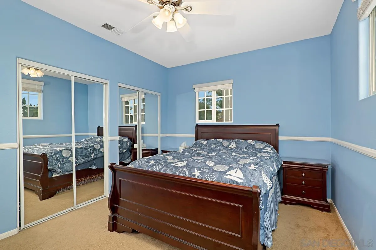 1707 Horizon Heights Circle El Cajon, CA 92019 - Photo 15 of 26 a bed room with a bed and a chandelier