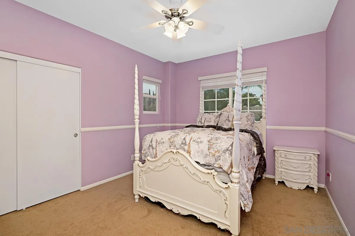 1707 Horizon Heights Circle El Cajon, CA 92019 - Photo 16 of 26 a bedroom with a bed and a chandelier