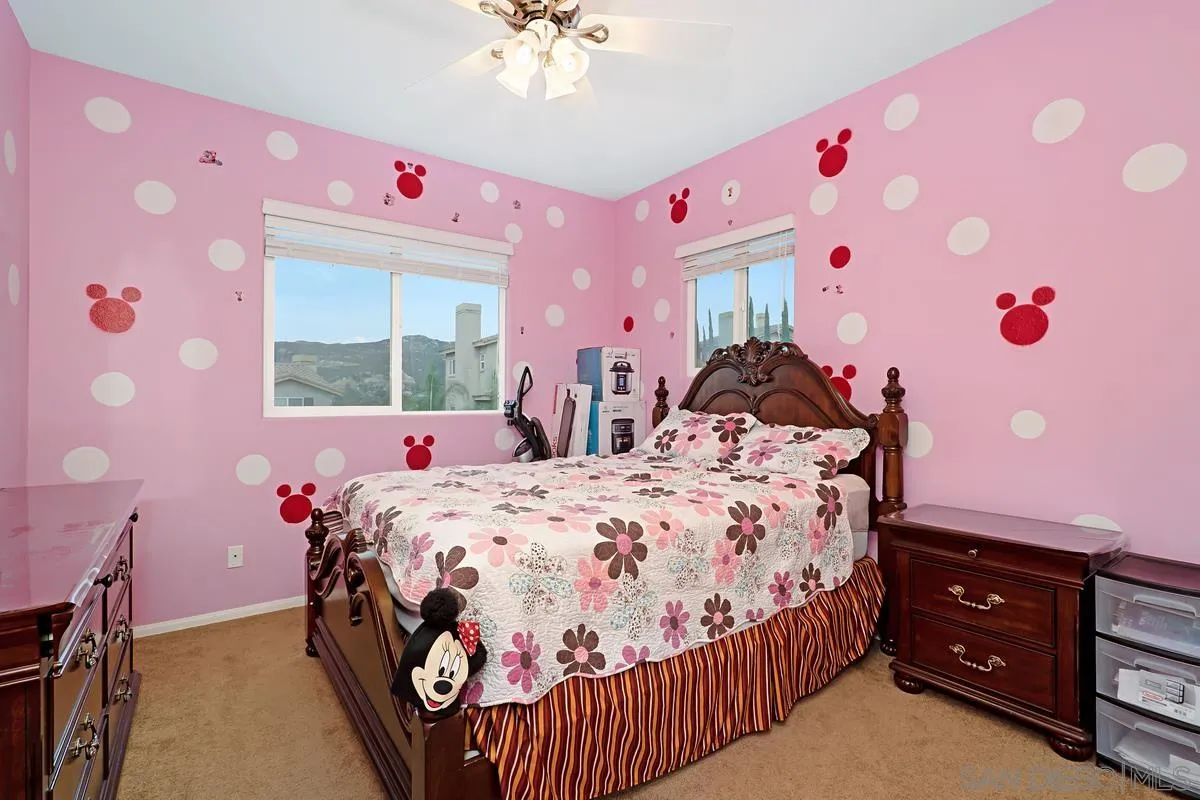 1707 Horizon Heights Circle El Cajon, CA 92019 - Photo 17 of 26 a bedroom with a bed and a dresser