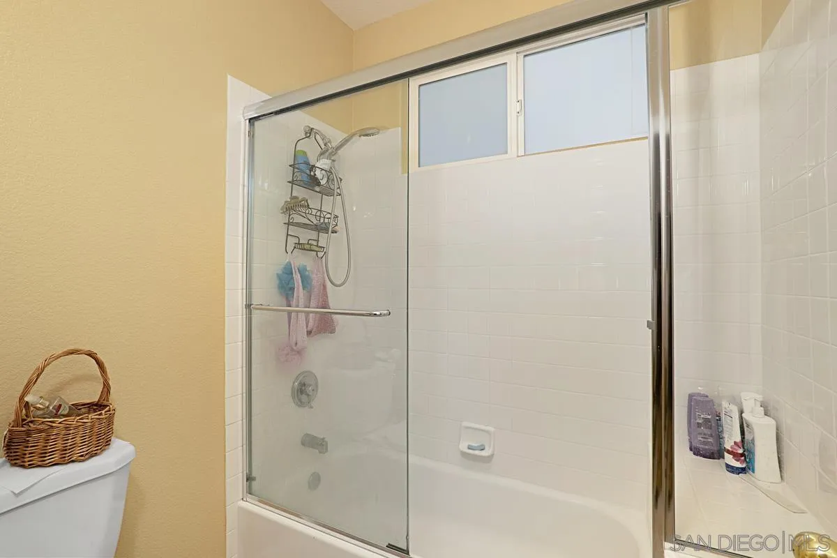 1707 Horizon Heights Circle El Cajon, CA 92019 - Photo 19 of 26 a bathroom with a shower a sink and a mirror