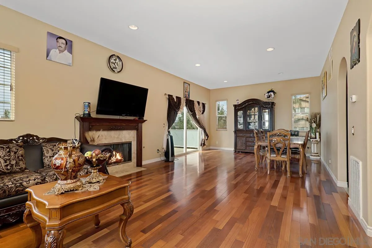 1707 Horizon Heights Circle El Cajon, CA 92019 - Photo 2 of 26 a living room with furniture a flat screen tv and a wooden floor