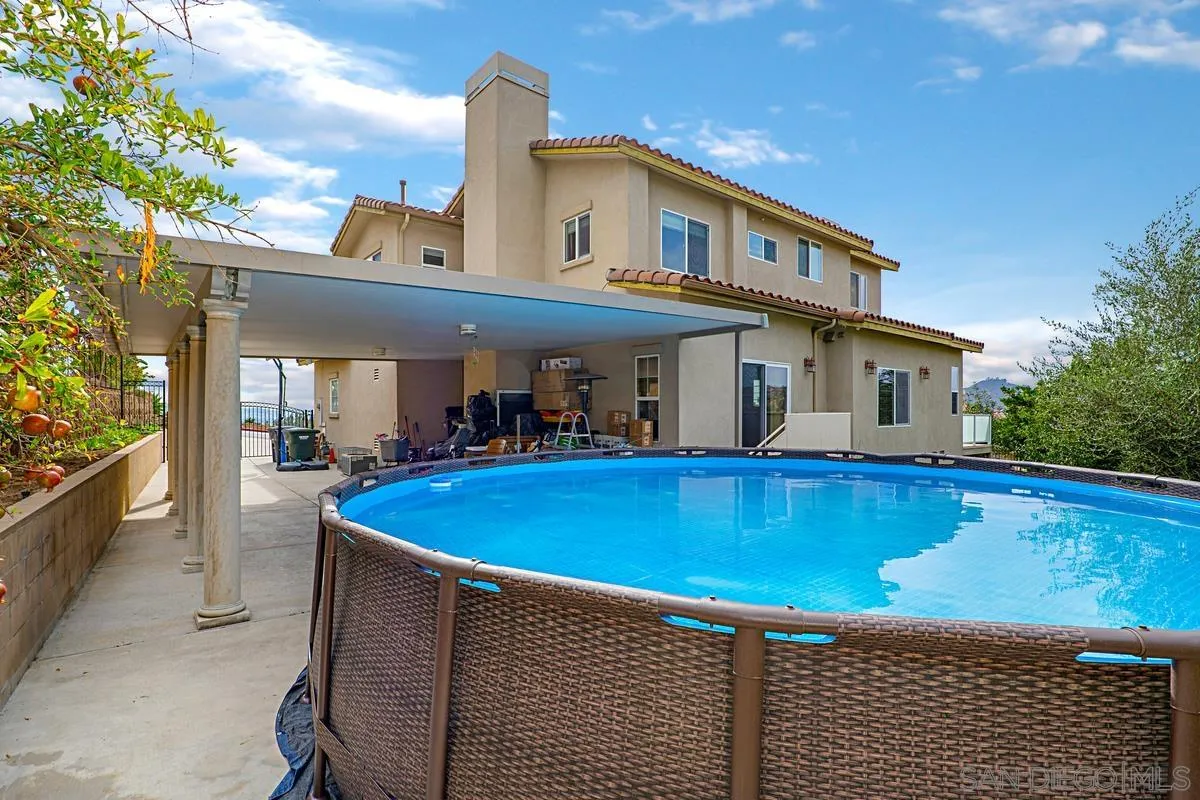 1707 Horizon Heights Circle El Cajon, CA 92019 - Photo 23 of 26 a view of a house with pool and chairs