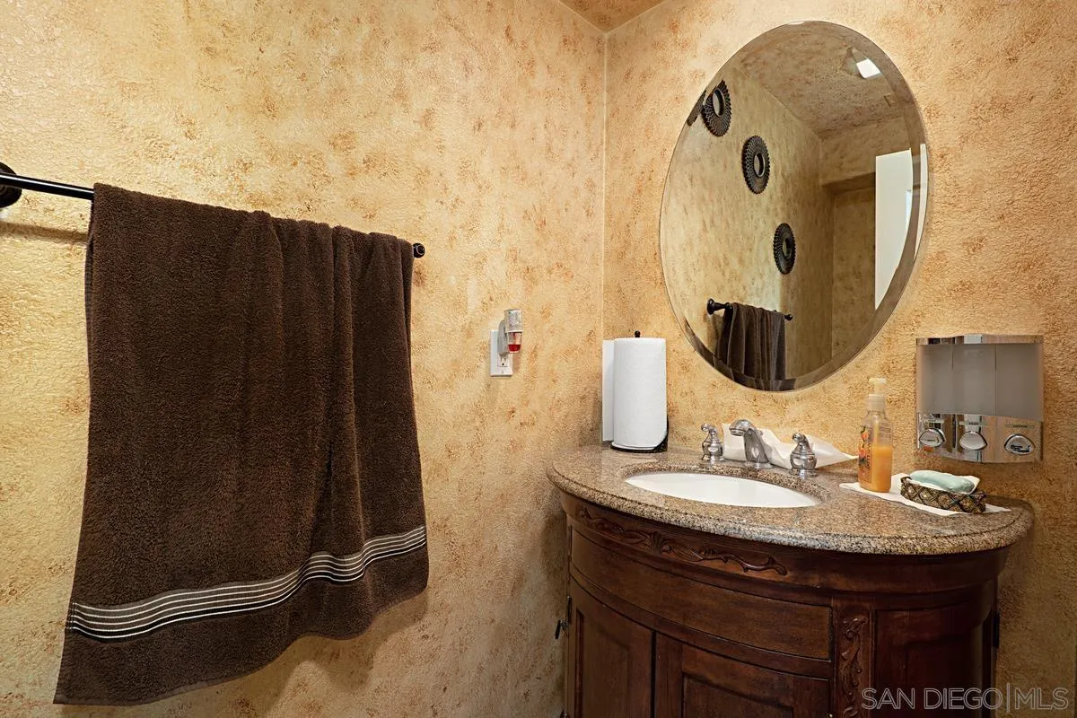 1707 Horizon Heights Circle El Cajon, CA 92019 - Photo 7 of 26 a bathroom with a sink and mirror
