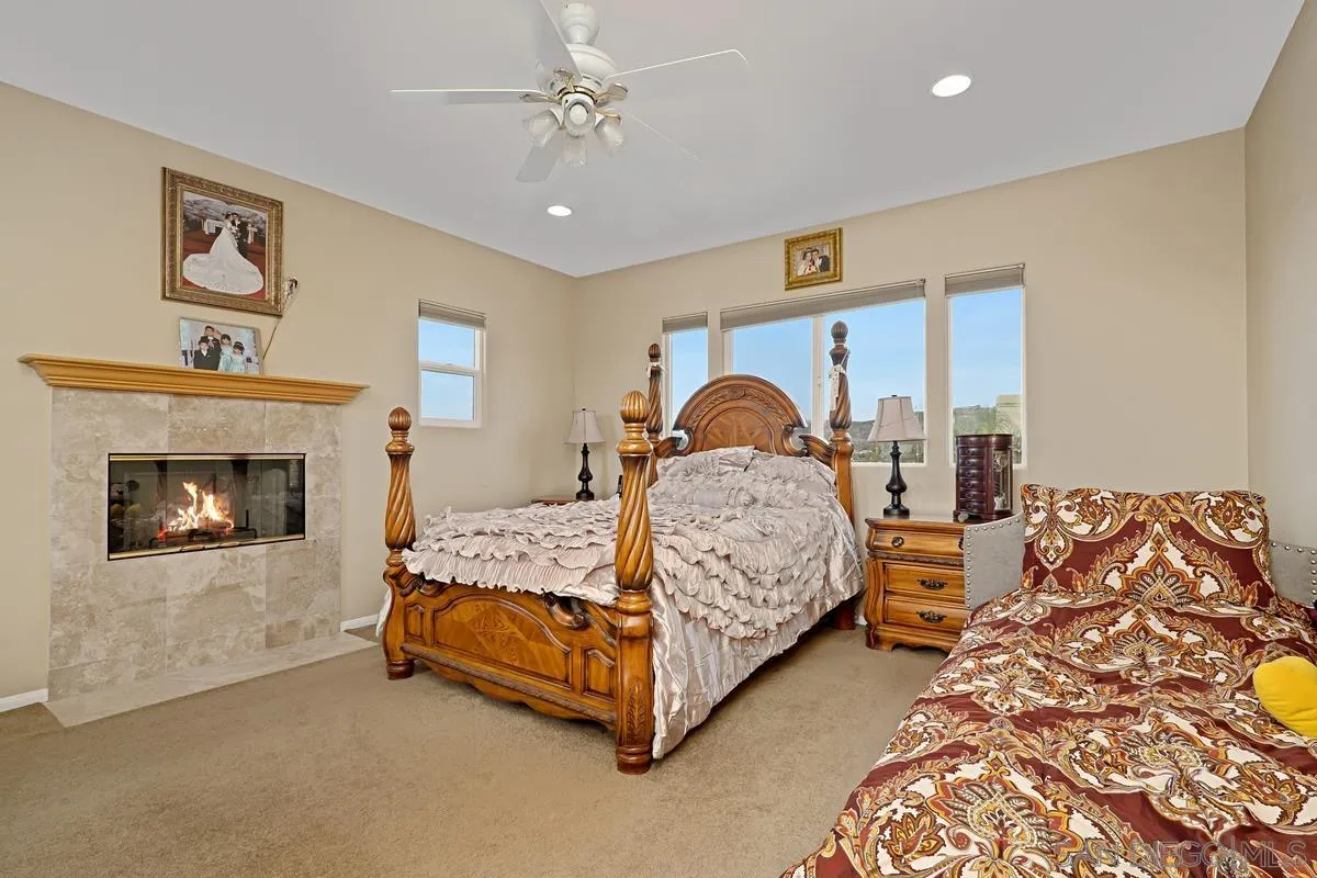 1707 Horizon Heights Circle El Cajon, CA 92019 - Photo 9 of 26 a bedroom with bed and a fireplace