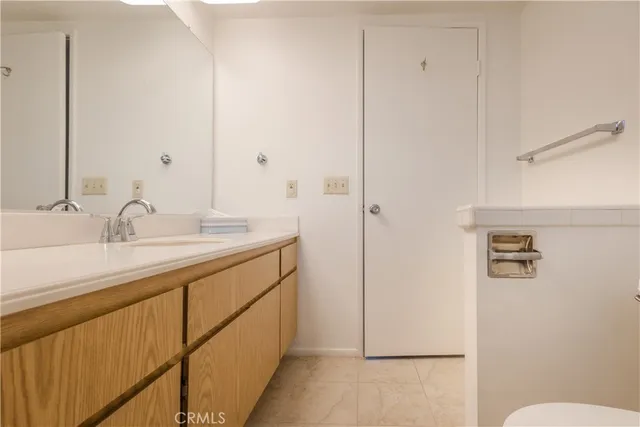 a view of a livingroom with a ceiling fan and window
