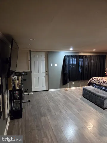 a living room with a couch and a table with wooden floor