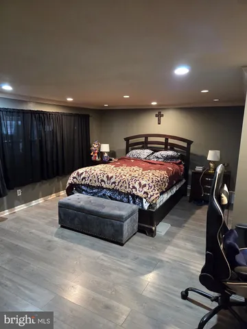 a bedroom with a bed and a desk